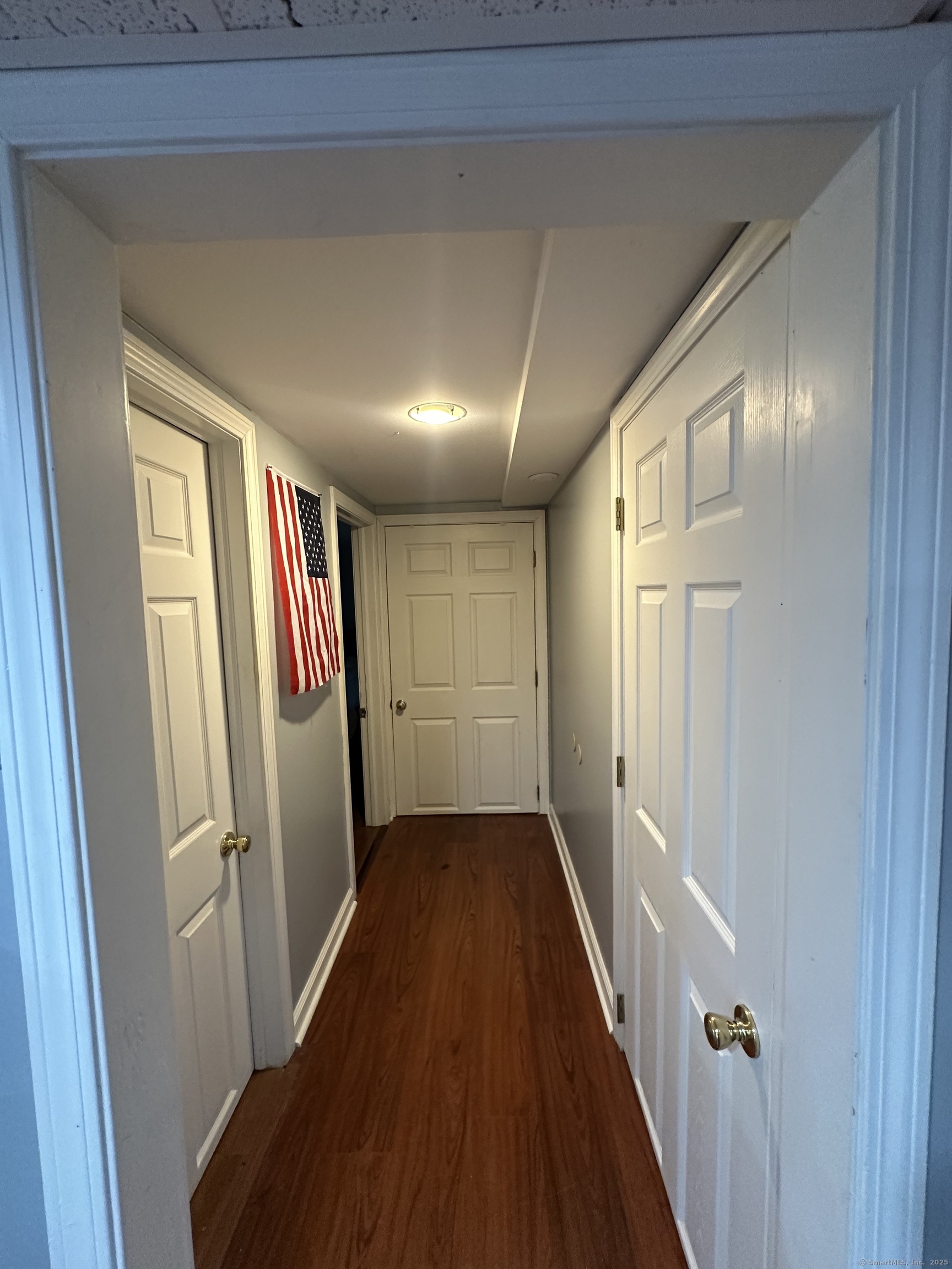 196 Monroe Street Milford, CT 06460 - Photo 24 of 31 a view of a hallway with wooden floor and staircase