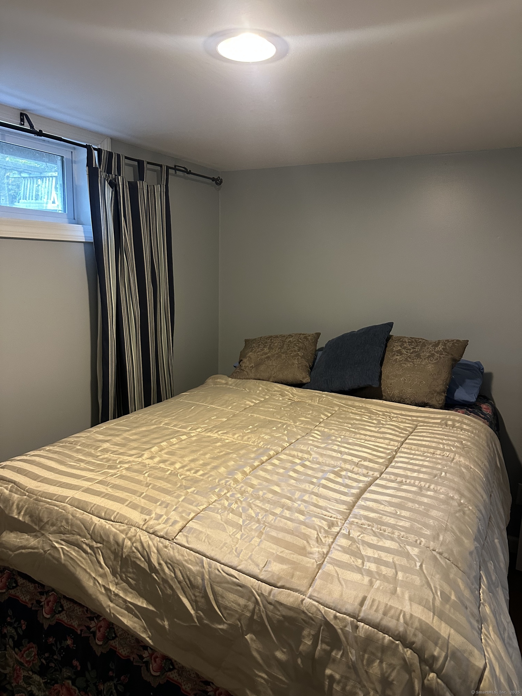 196 Monroe Street Milford, CT 06460 - Photo 26 of 31 a bedroom with a bed and a dresser