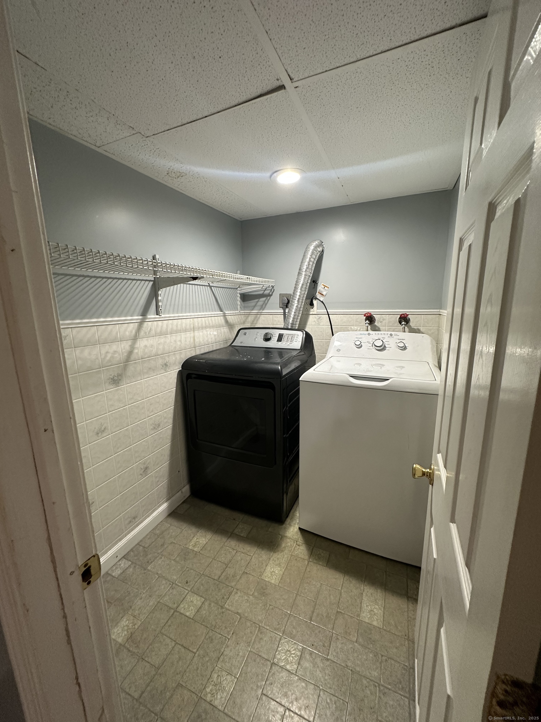 196 Monroe Street Milford, CT 06460 - Photo 29 of 31 a utility room with dryer and washer