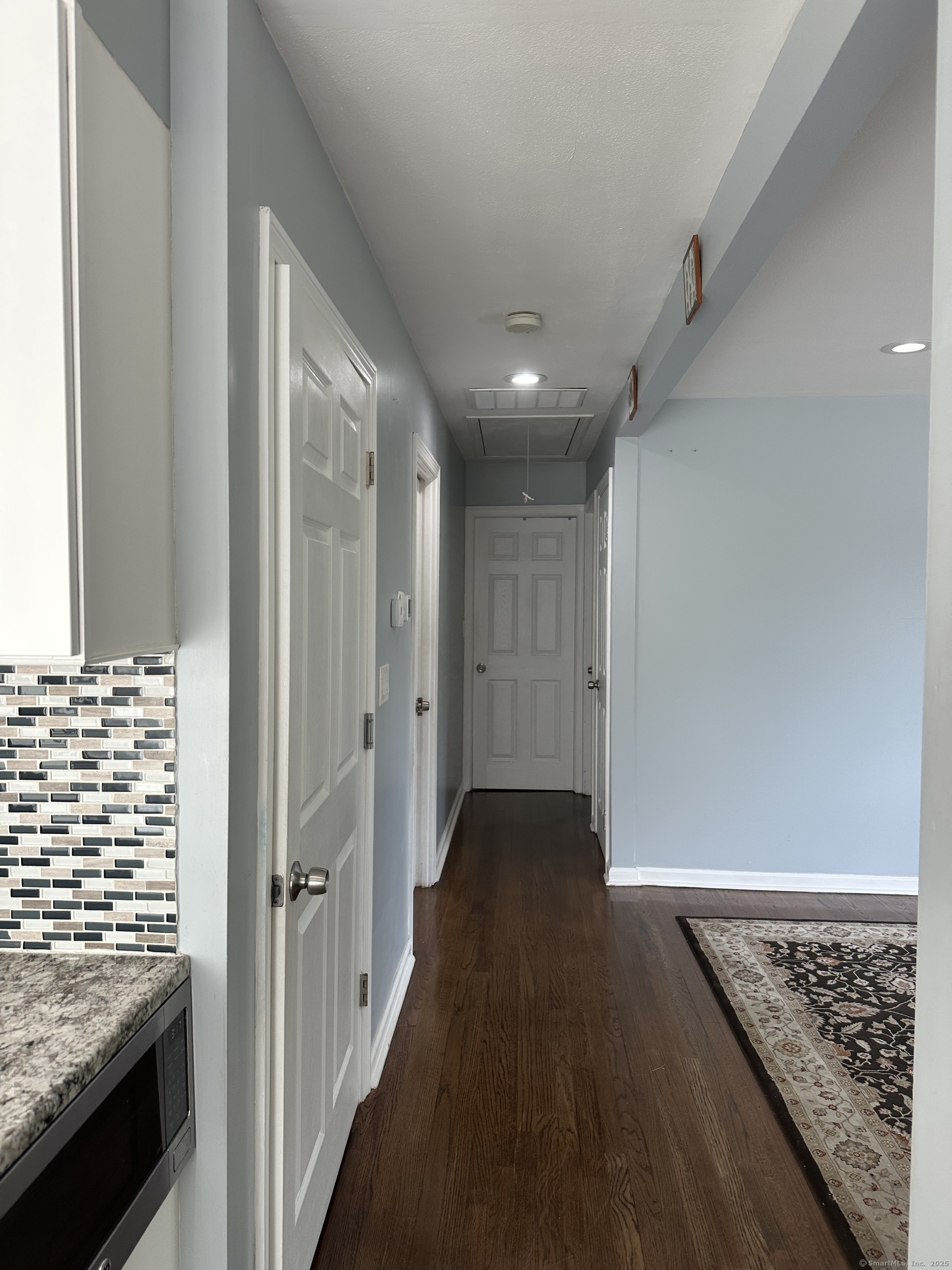 196 Monroe Street Milford, CT 06460 - Photo 3 of 31 a view of hallway with wooden floor