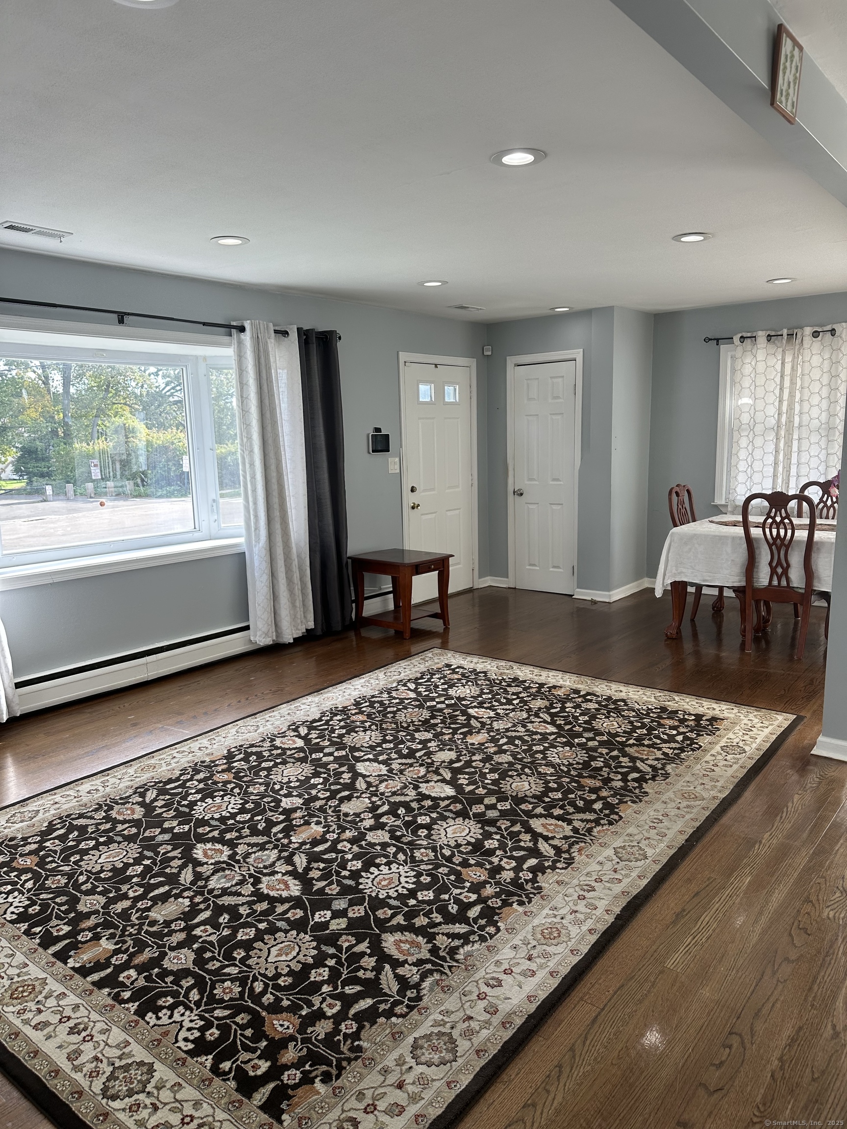 196 Monroe Street Milford, CT 06460 - Photo 7 of 31 an entryway of a house with a rug