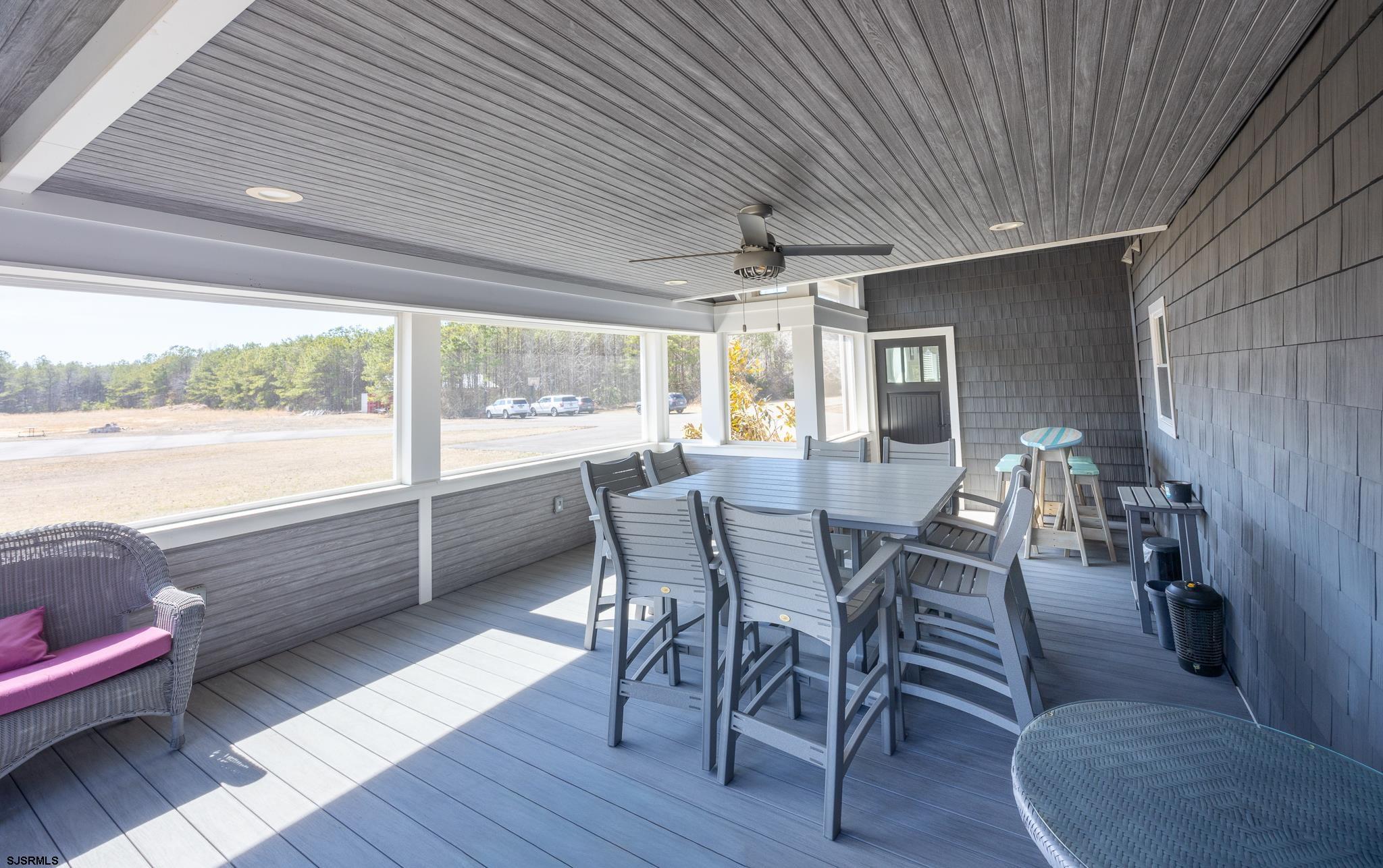 1309 Tyler Road Woodbine, NJ 08270 - Photo 16 of 84 a dining room with furniture a chandelier and wooden floor