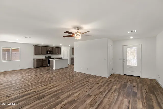 a view of a kitchen with microwave and floor to ceiling window