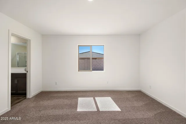 an empty room with a bathroom