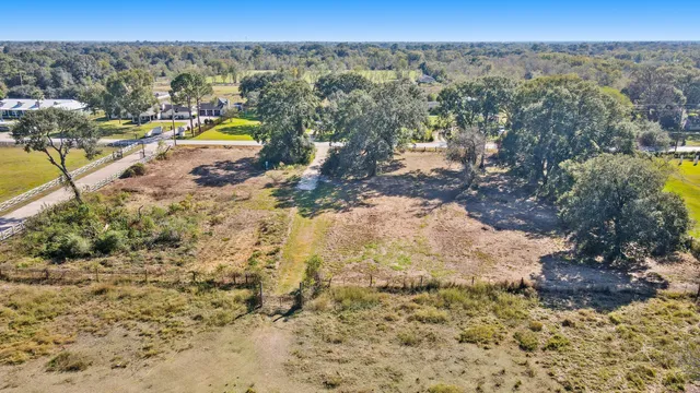 a view of a swimming pool with a yard