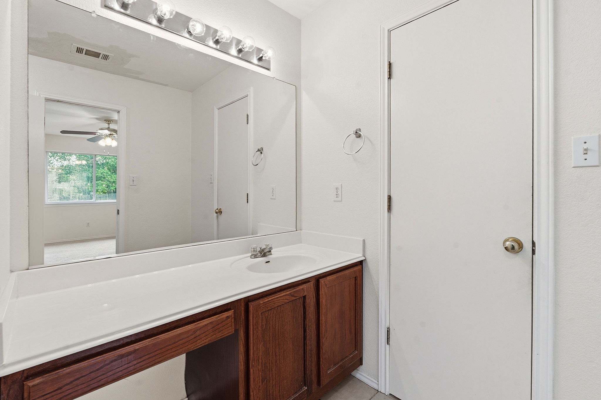 116 Blue Ridge Trail Elgin, TX 78621 - Photo 17 of 28 a bathroom with a sink and a mirror