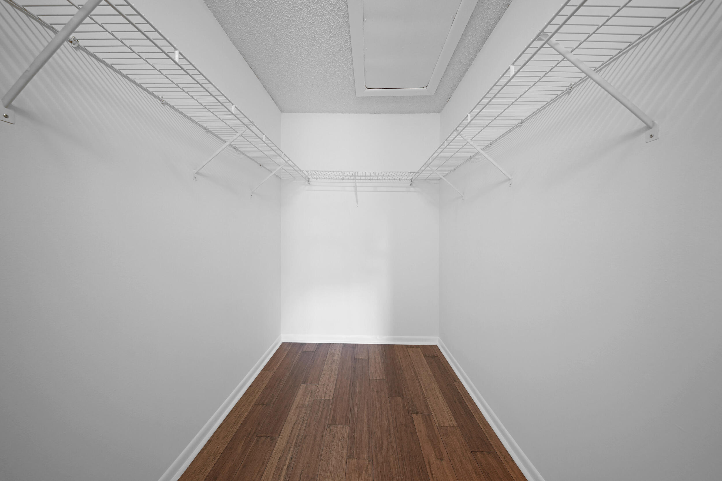 9480 Boca Cove Circle, Unit 415 Boca Raton, FL 33428 - Photo 22 of 25 a view of a hallway with wooden floor