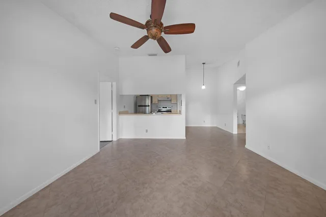 a view of a kitchen with a sink and cabinet