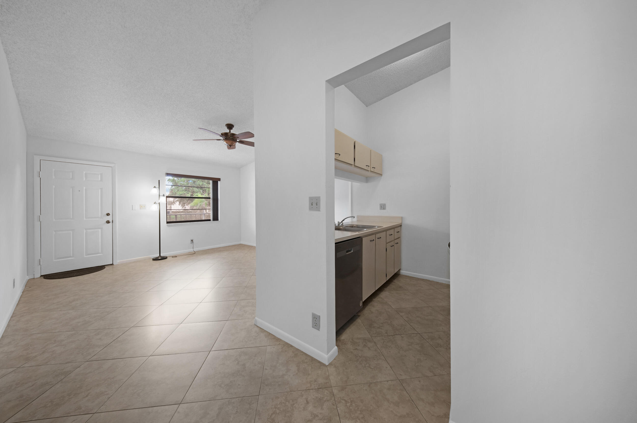9480 Boca Cove Circle, Unit 415 Boca Raton, FL 33428 - Photo 9 of 25 a view of a storage & utility room with washer and dryer