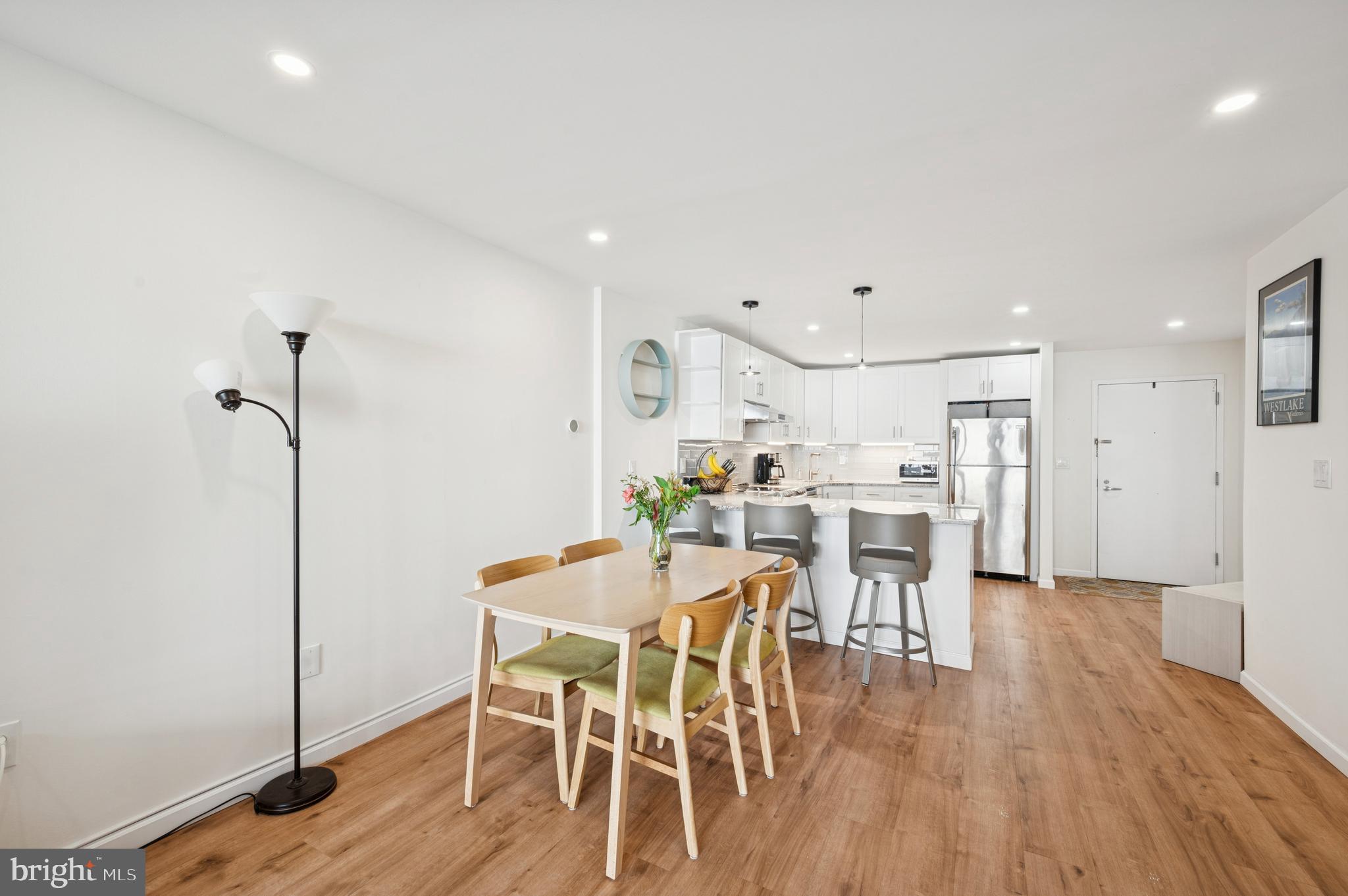 233 South 6th Street, Unit 904 Philadelphia, PA 19106 - Photo 6 of 16 a view of a dining room with furniture and wooden floor