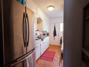 1849 West Main Street, Unit 2 Houston, TX 77098 - Photo 6 of 9 This vintage kitchen blends nostalgic charm with the ease of modern appliances.