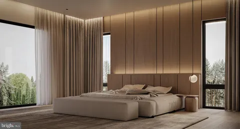 a living room with furniture and large window