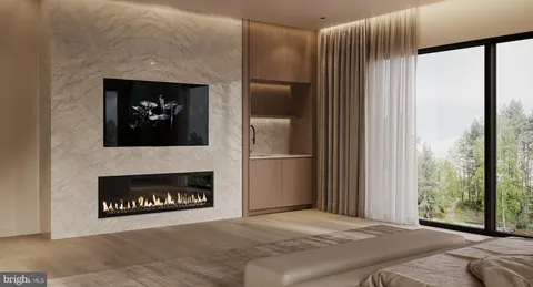 a bed sitting in a bedroom next to a balcony