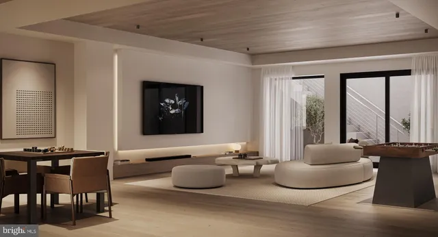 a living room with furniture and large windows