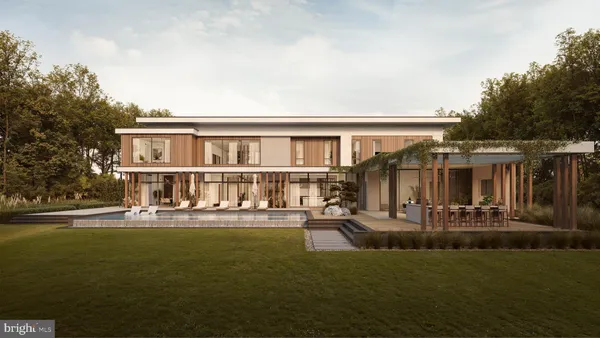 a front view of a house with sitting area