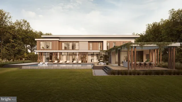 a front view of a house with sitting area