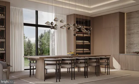 a view of a dining room with furniture and window