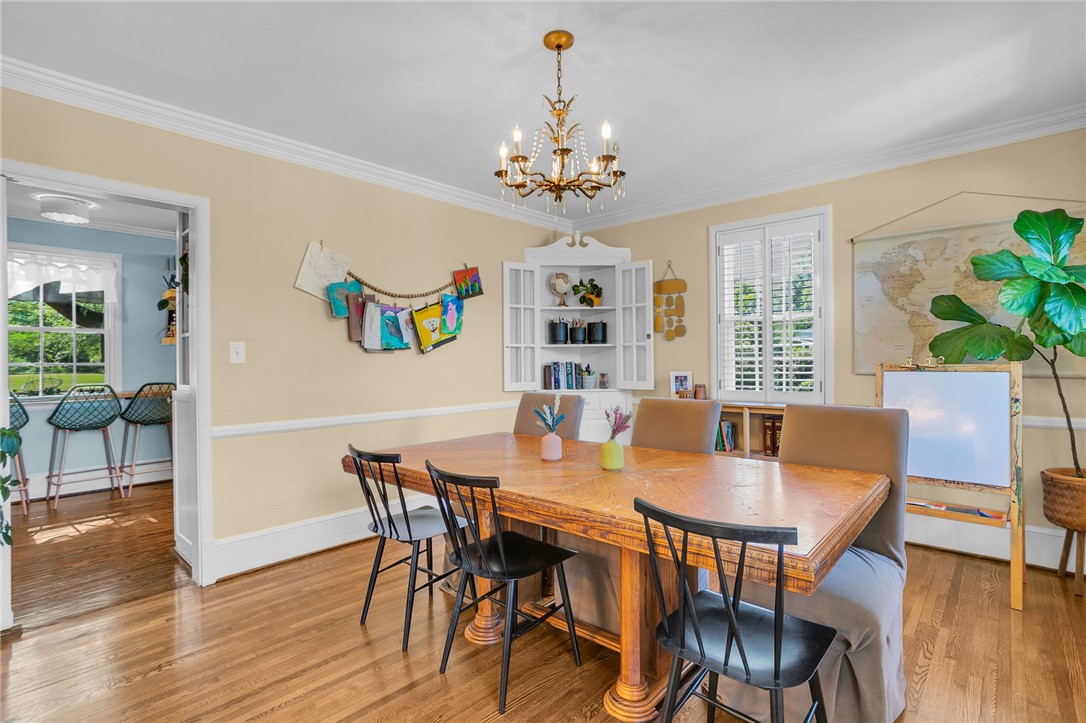 1107 Springdale Road Anderson, SC 29621 - Photo 12 of 49 This inviting dining area features elegant hardwood flooring and a stylish chandelier.