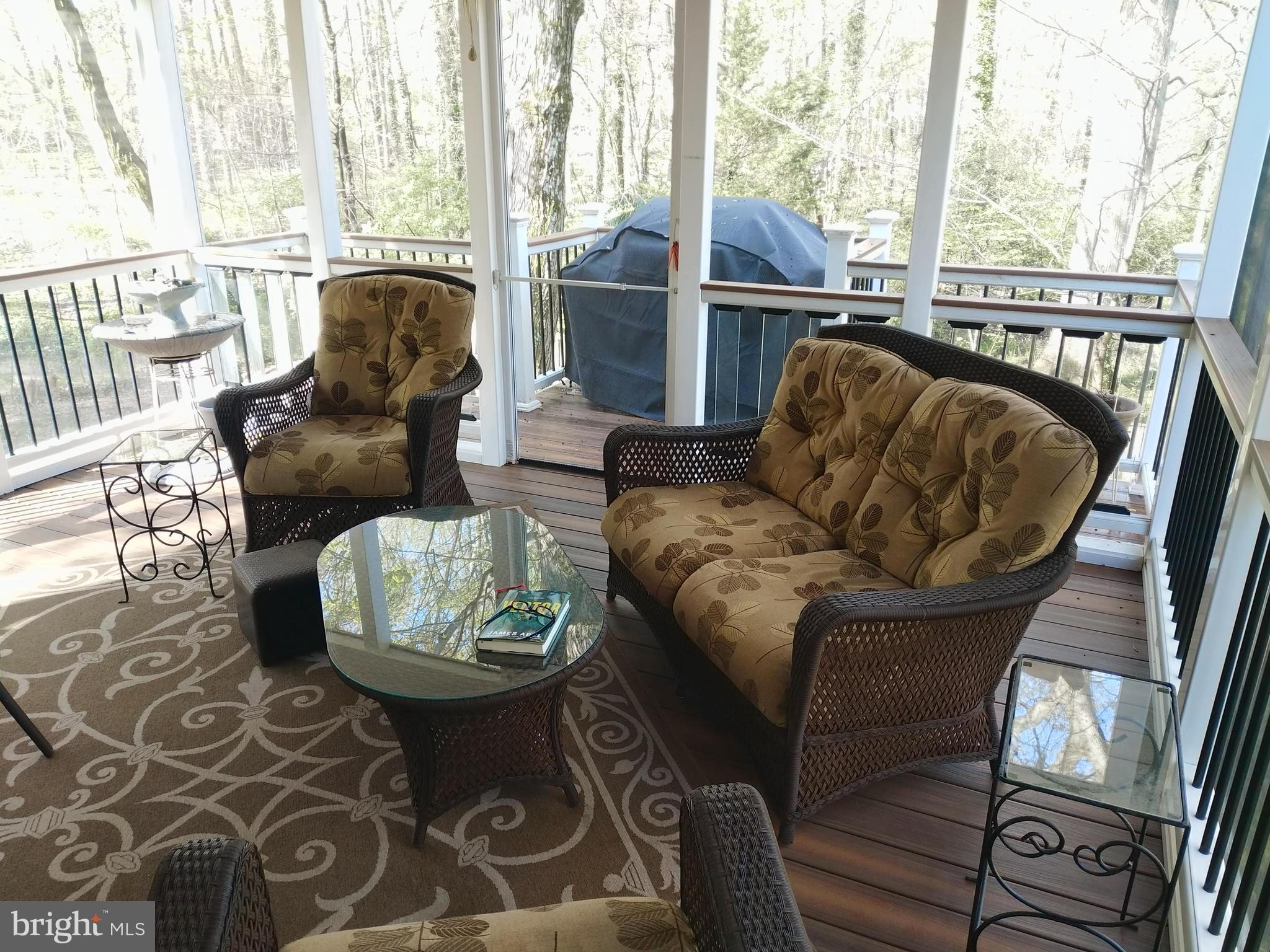 8312 Crown Court Road Alexandria, VA 22308 - Photo 25 of 68 Screened in porch seating area