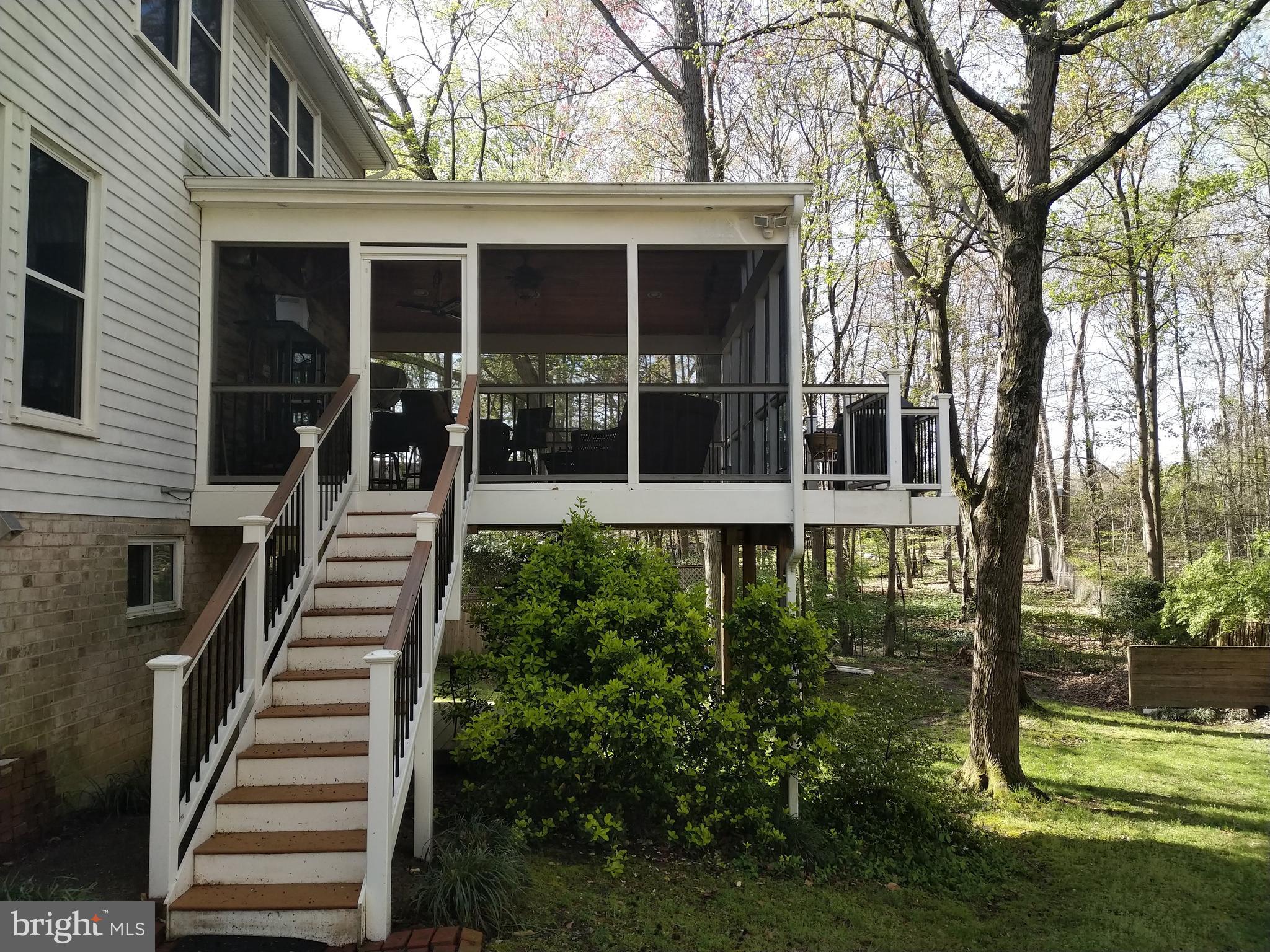 8312 Crown Court Road Alexandria, VA 22308 - Photo 34 of 68 View of screened porch from yard