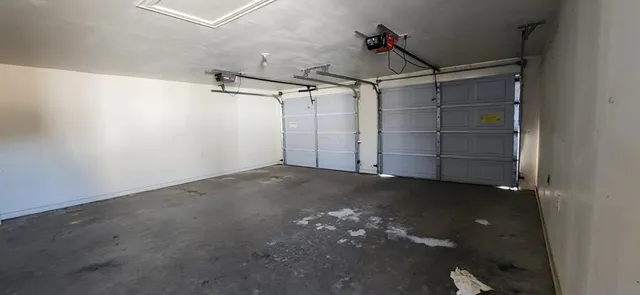 a view of empty room with ceiling fan