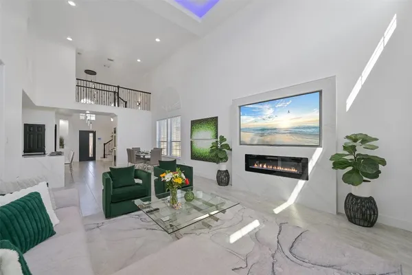 a hallway with a couch and a potted plant