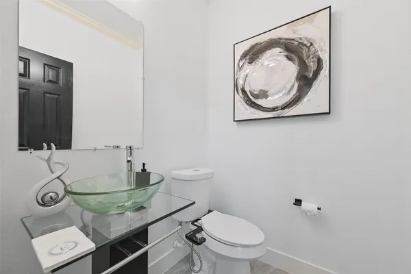 a bathroom with a toilet and a sink