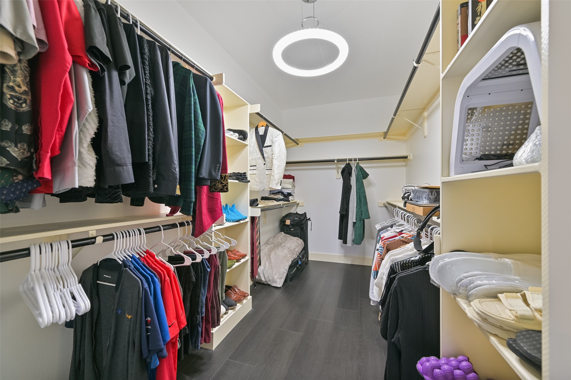 2007 Que Manor Drive Houston, TX 77090 - Photo 22 of 29 a view of walk in closet with clothes and shoes