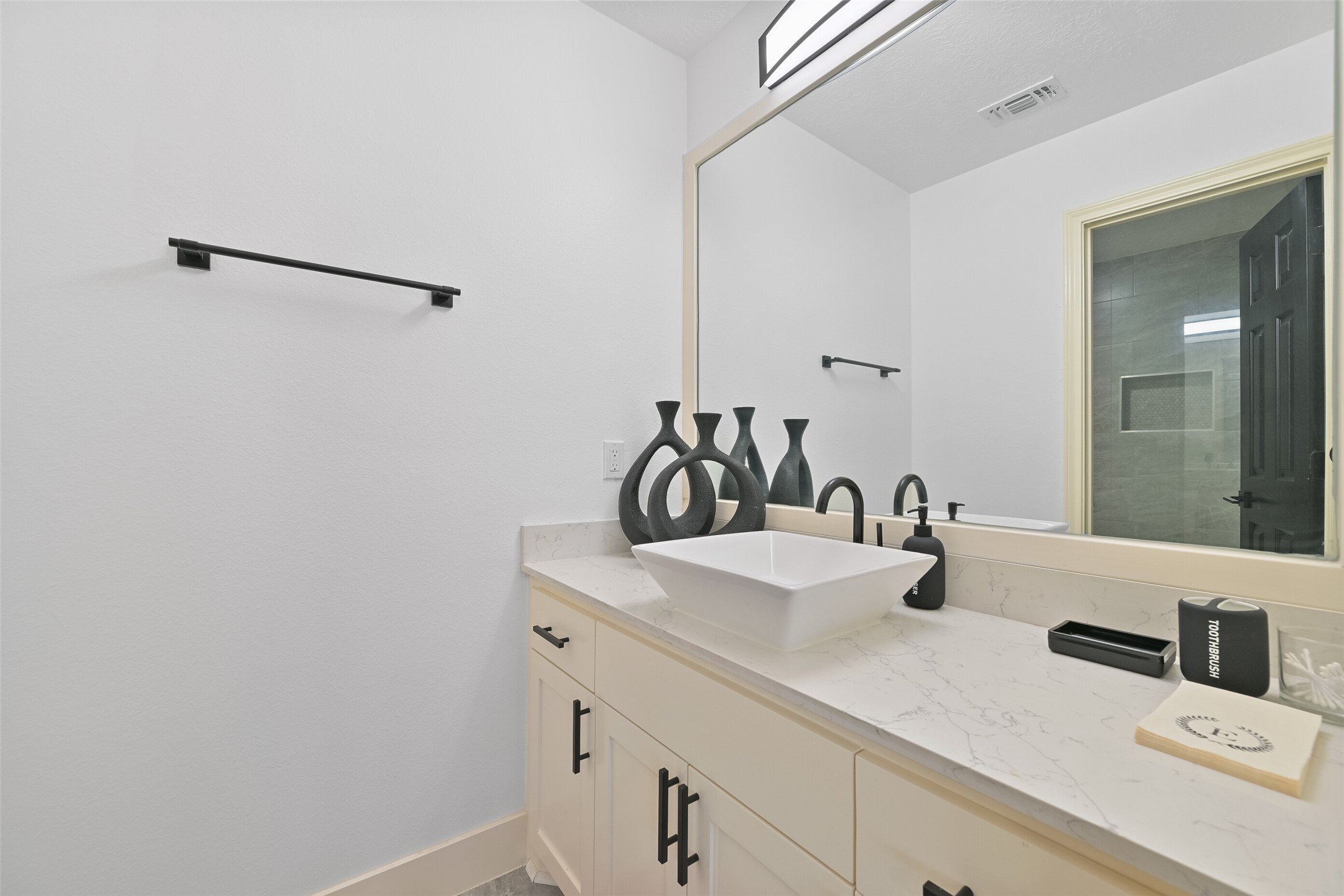 2007 Que Manor Drive Houston, TX 77090 - Photo 25 of 29 a bathroom with a sink and a mirror