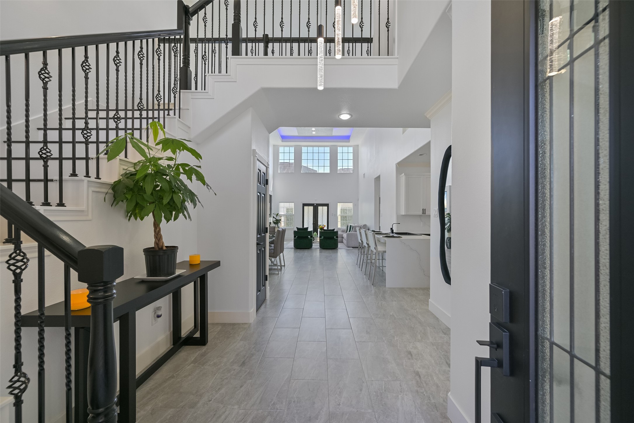 2007 Que Manor Drive Houston, TX 77090 - Photo 4 of 29 a view of a hallway with entryway wooden floor and livingroom with furniture