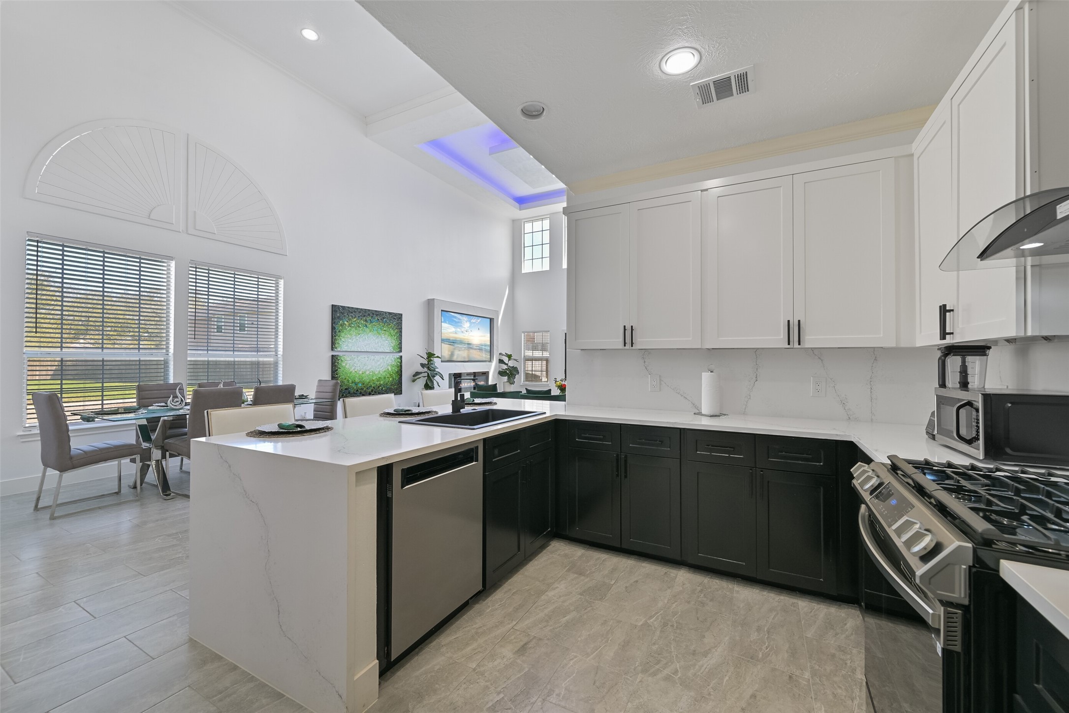 2007 Que Manor Drive Houston, TX 77090 - Photo 10 of 29 a kitchen with a sink stove and cabinets