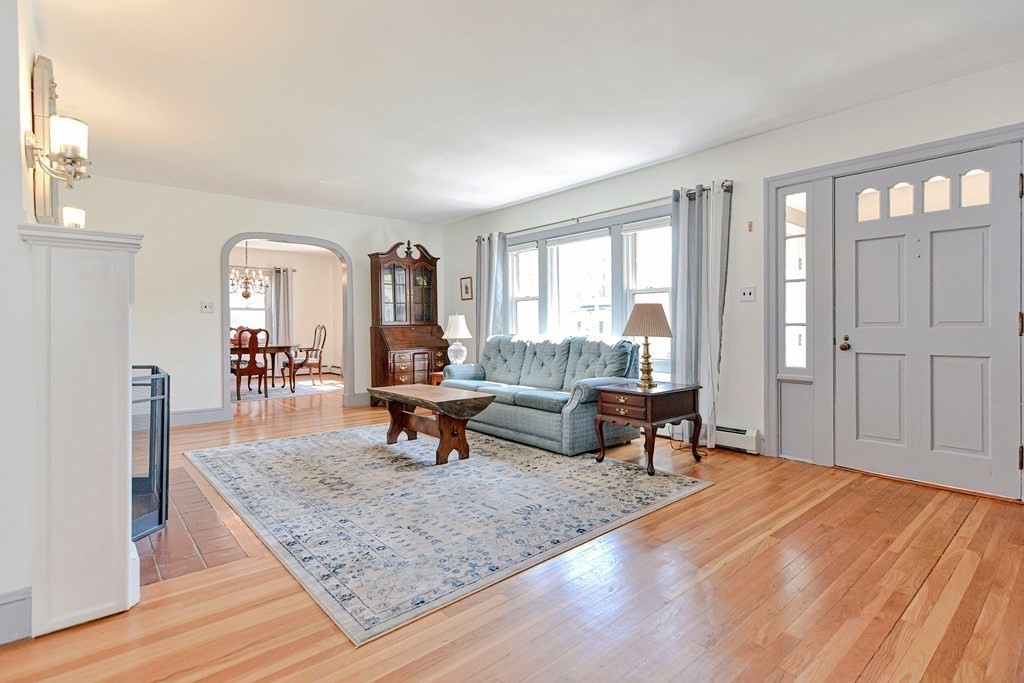 18 1/2 Whitney Street Milford, MA 01757 - Photo 11 of 34 a living room with furniture and a wooden floor