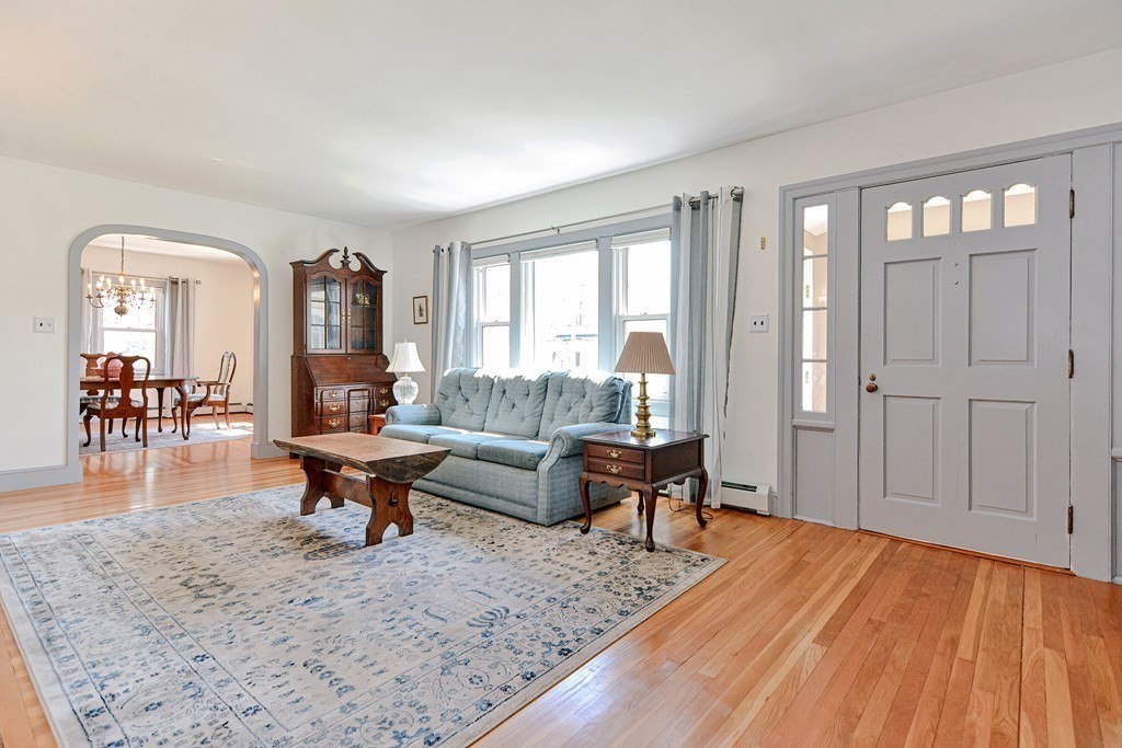 18 1/2 Whitney Street Milford, MA 01757 - Photo 12 of 34 a living room with furniture and a wooden floor