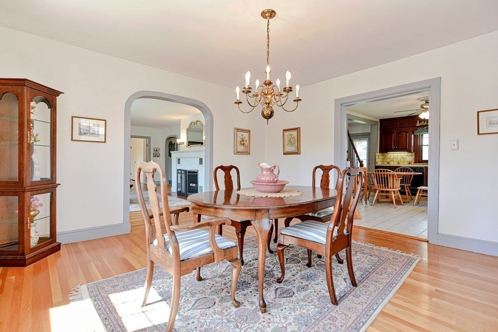 18 1/2 Whitney Street Milford, MA 01757 - Photo 14 of 34 a view of a dining room with furniture wooden floor and a chandelier