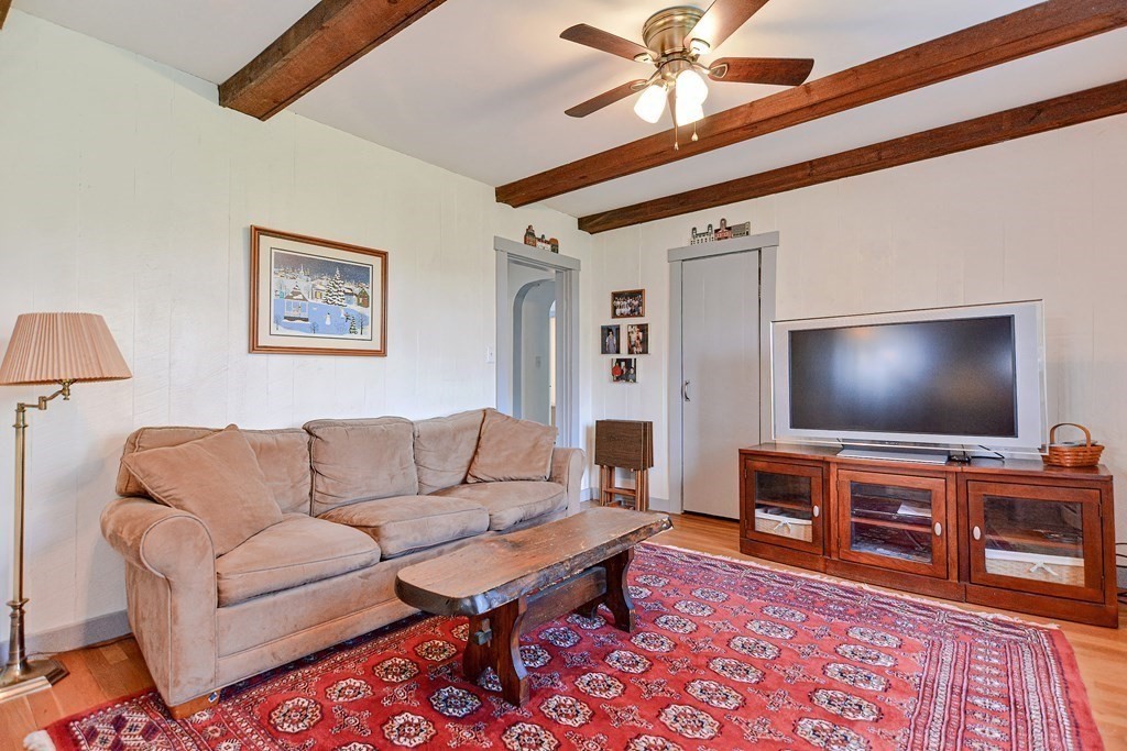 18 1/2 Whitney Street Milford, MA 01757 - Photo 18 of 34 a living room with furniture and a flat screen tv