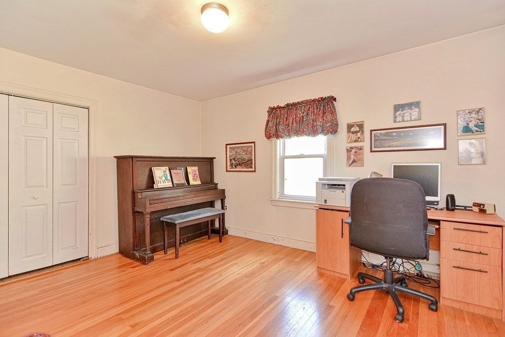 18 1/2 Whitney Street Milford, MA 01757 - Photo 21 of 34 a view of a workspace with furniture and a window