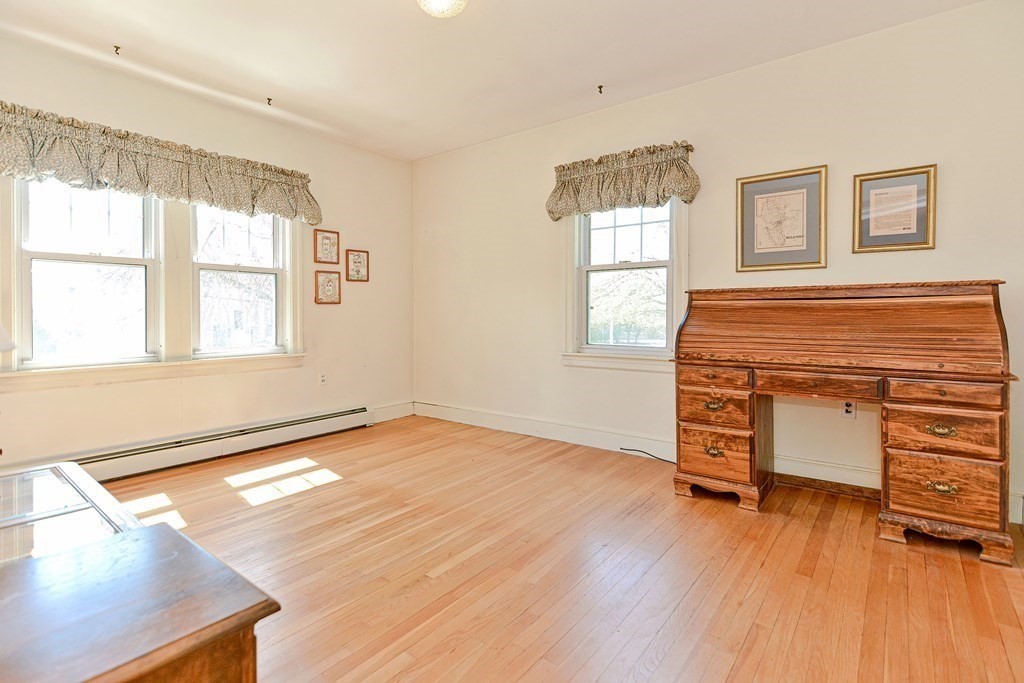 18 1/2 Whitney Street Milford, MA 01757 - Photo 23 of 34 a view of an empty room with wooden floor and a window