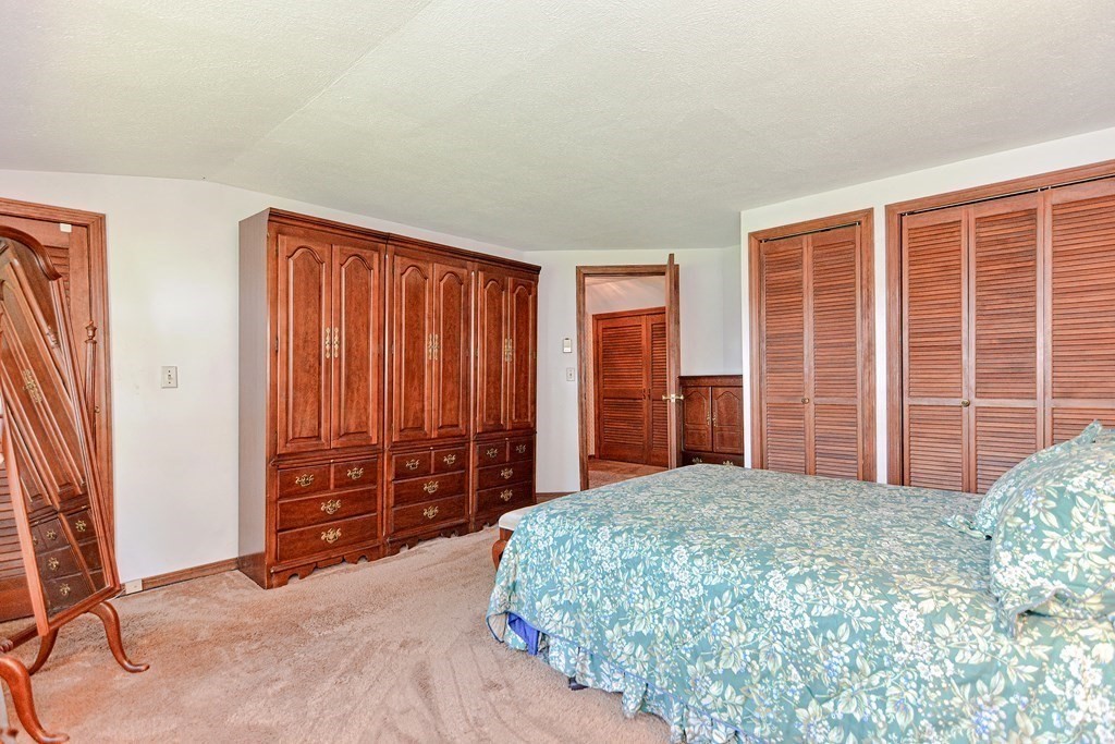 18 1/2 Whitney Street Milford, MA 01757 - Photo 25 of 34 a bedroom with a large bed and window