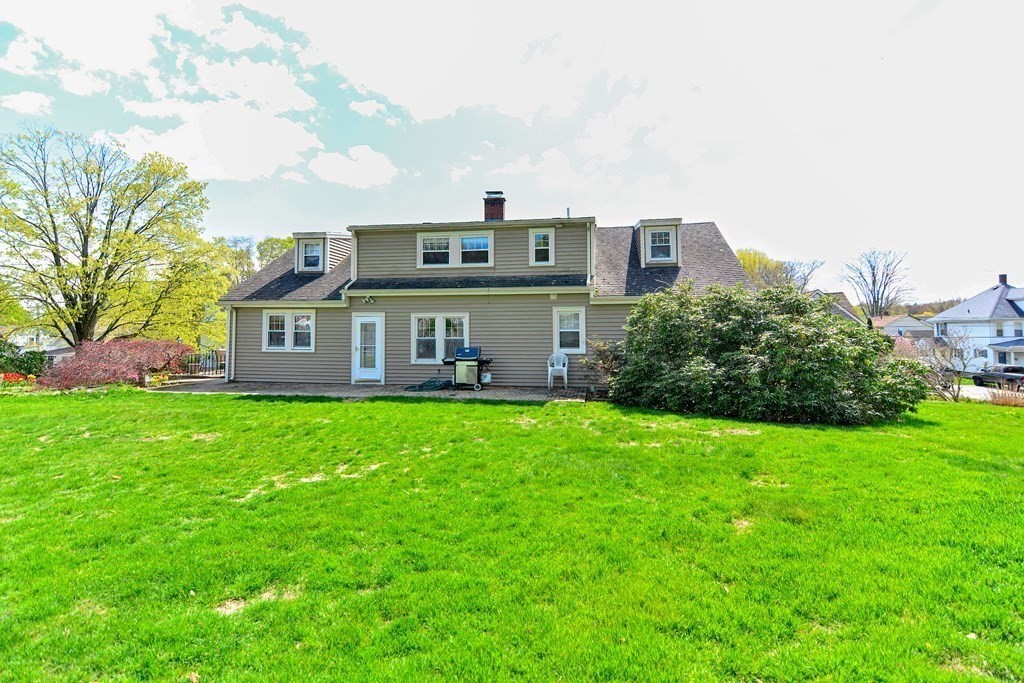 18 1/2 Whitney Street Milford, MA 01757 - Photo 33 of 34 a front view of a house with a garden