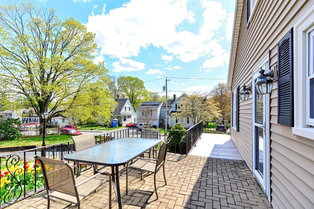 18 1/2 Whitney Street Milford, MA 01757 - Photo 4 of 34 a view of a patio with couches table and chairs and potted plants