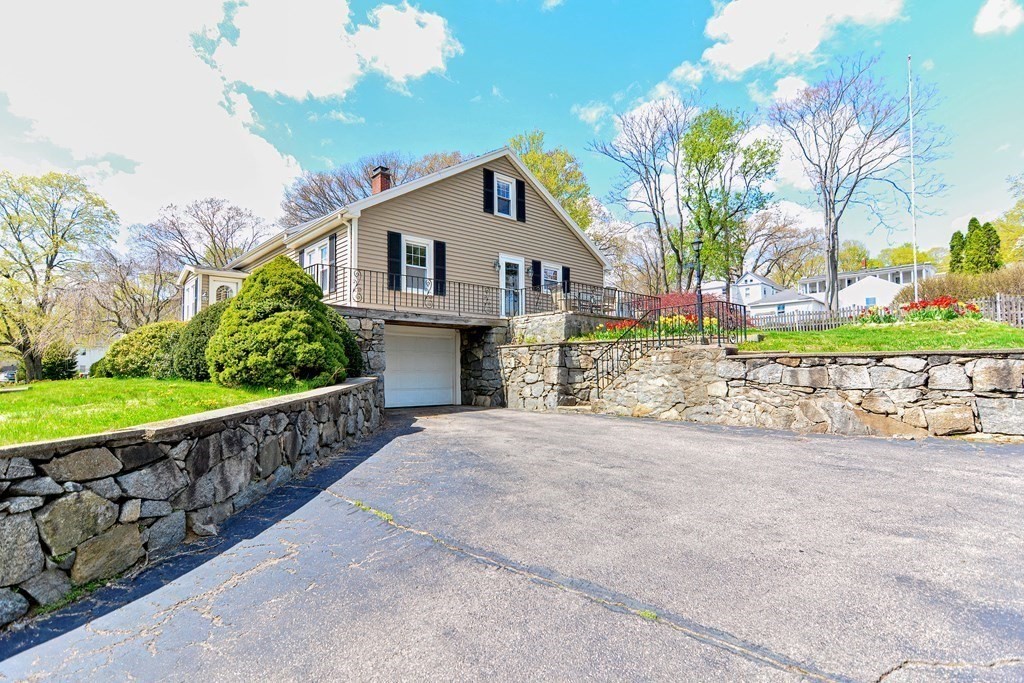 18 1/2 Whitney Street Milford, MA 01757 - Photo 5 of 34 a view of a house with a yard and potted plants