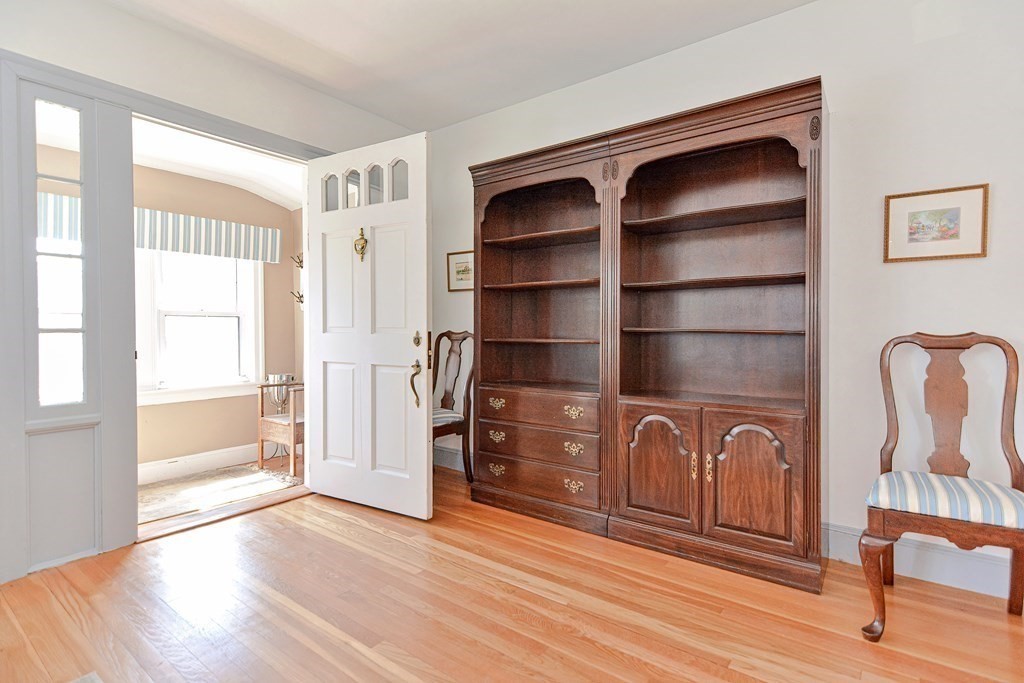18 1/2 Whitney Street Milford, MA 01757 - Photo 7 of 34 a view of an empty room with wooden floor and a window