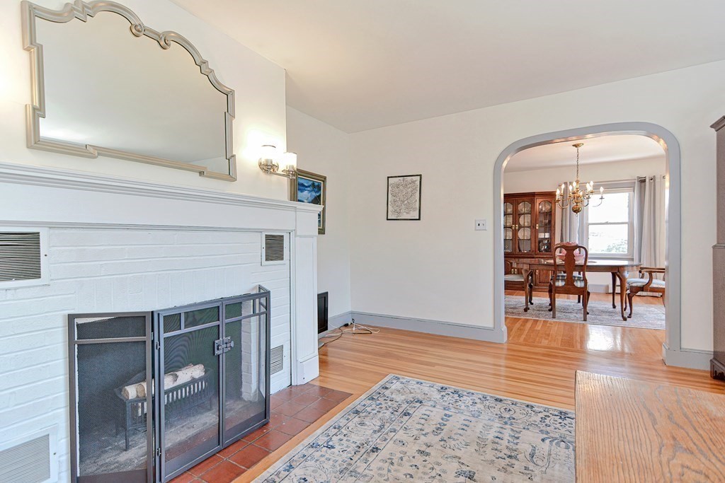 18 1/2 Whitney Street Milford, MA 01757 - Photo 8 of 34 a living room with furniture and a fireplace