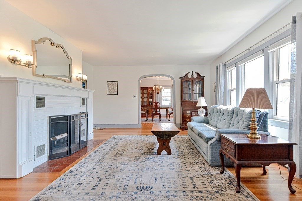 18 1/2 Whitney Street Milford, MA 01757 - Photo 9 of 34 a living room with furniture and a fireplace