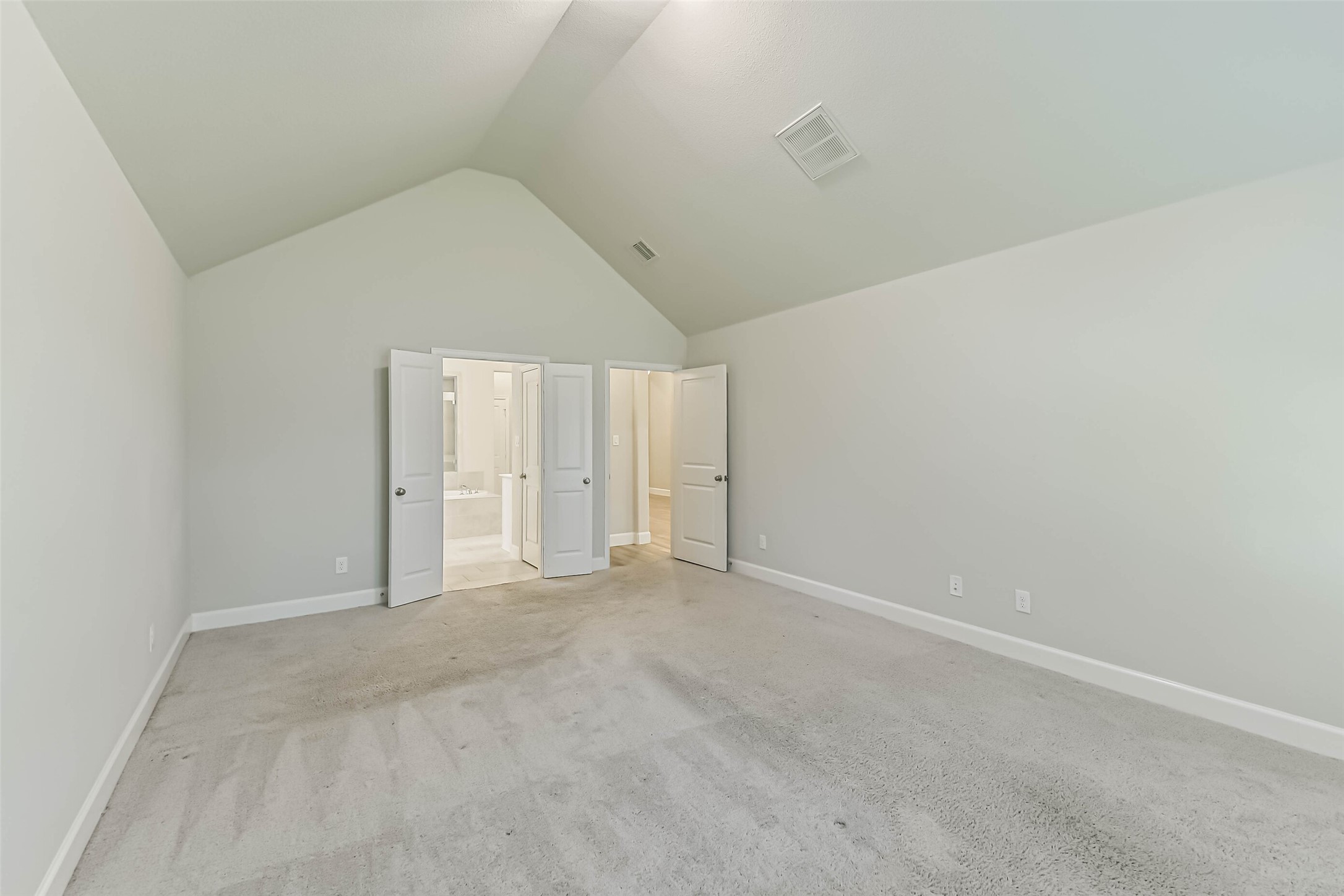8132 Tyrell Hgts Road Magnolia, TX 77354 - Photo 16 of 40 Step through elegant double doors into the inviting primary bath, blending style and comfort seamlessly.