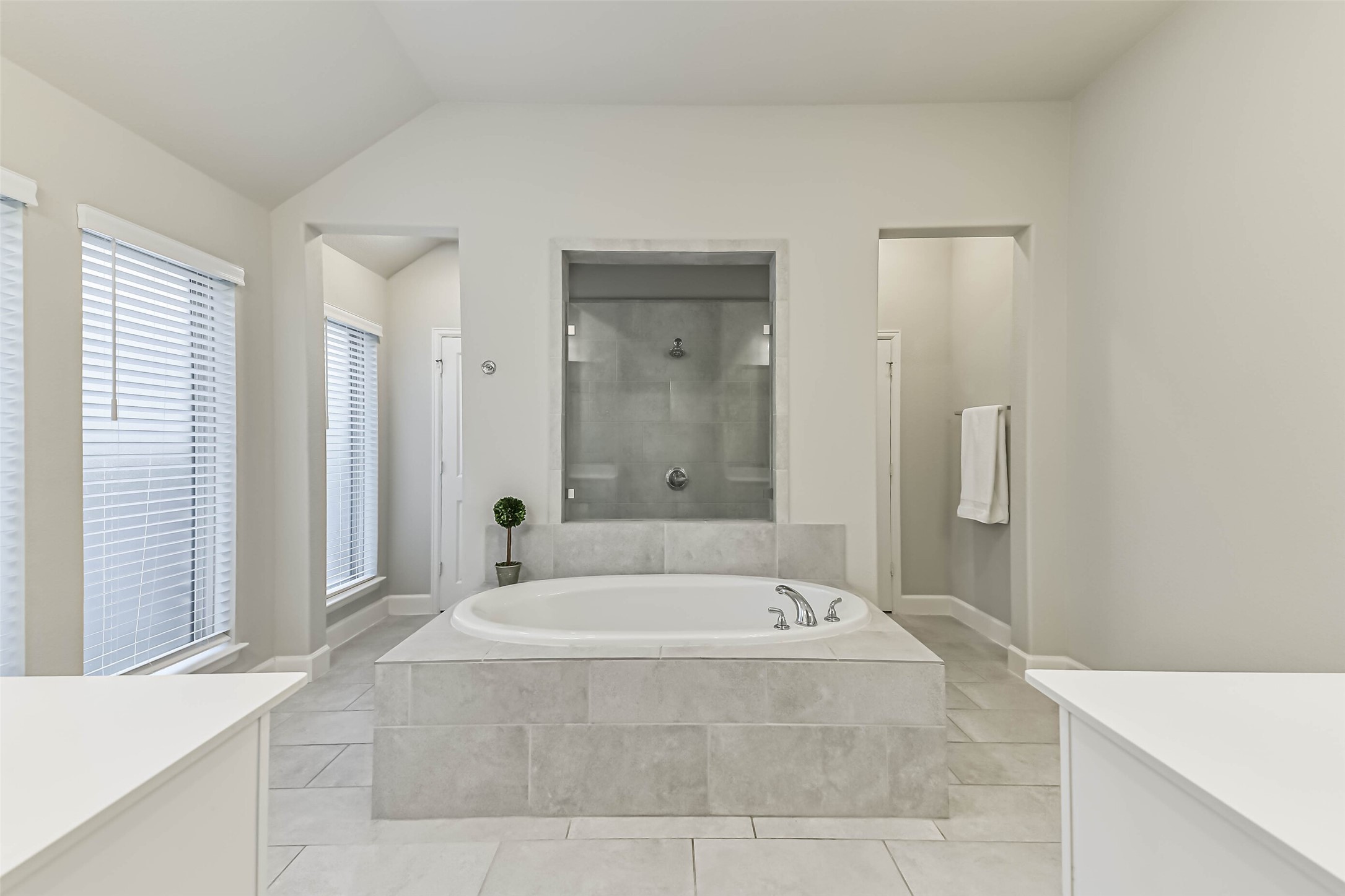 8132 Tyrell Hgts Road Magnolia, TX 77354 - Photo 17 of 40 Primary bathroom with with garden tub and separate glass-enclosed shower with two entries.