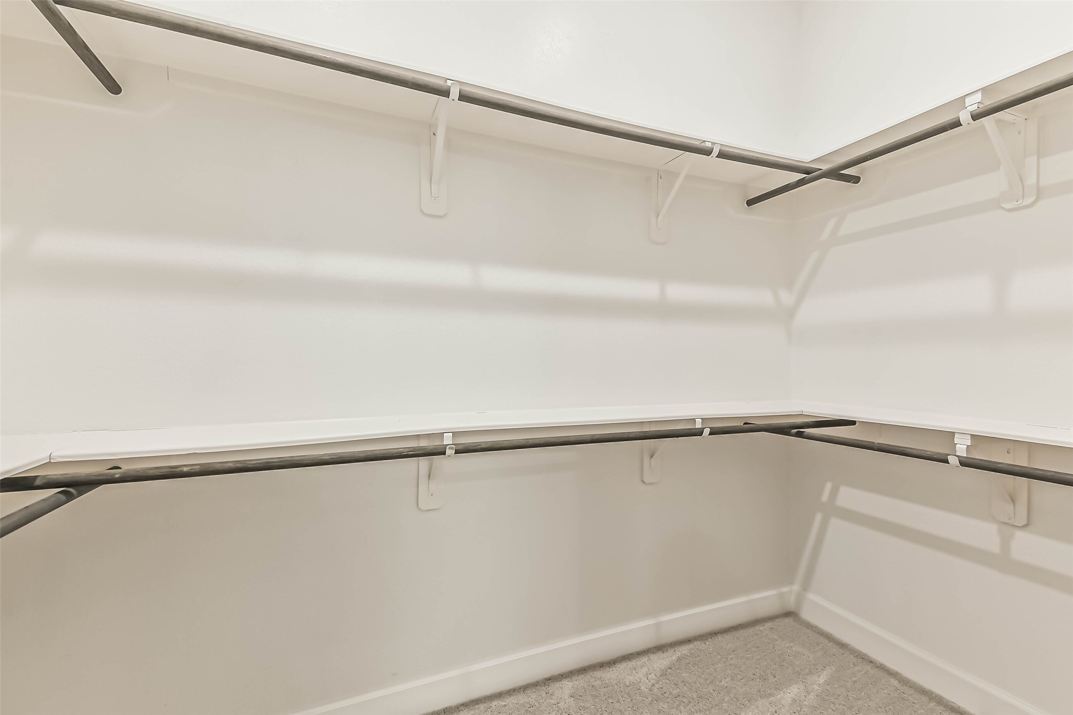 8132 Tyrell Hgts Road Magnolia, TX 77354 - Photo 20 of 40 Spacious primary closet for organized wardrobe.