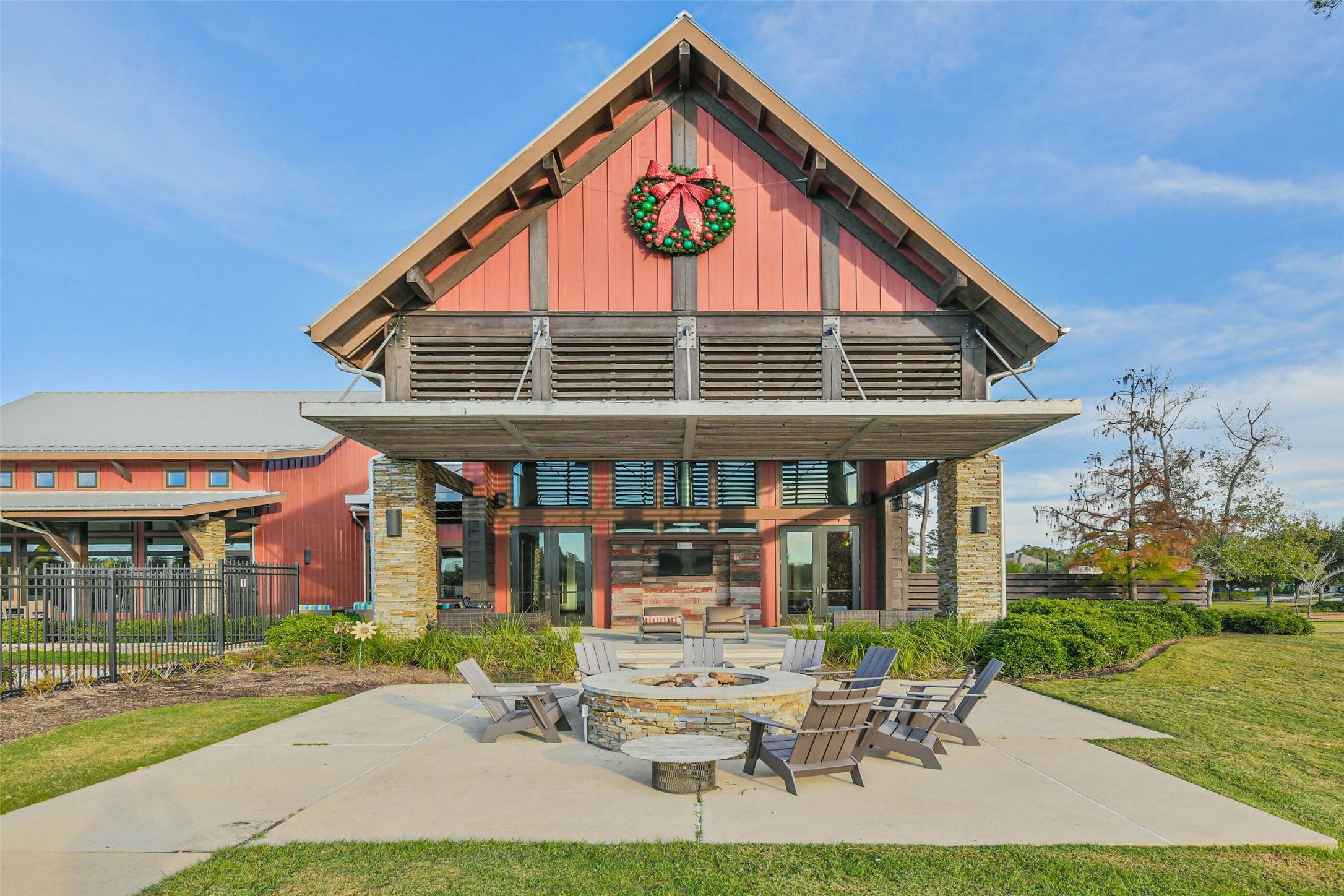 8132 Tyrell Hgts Road Magnolia, TX 77354 - Photo 38 of 40 Clubhouse with fire pit and sitting area in front.