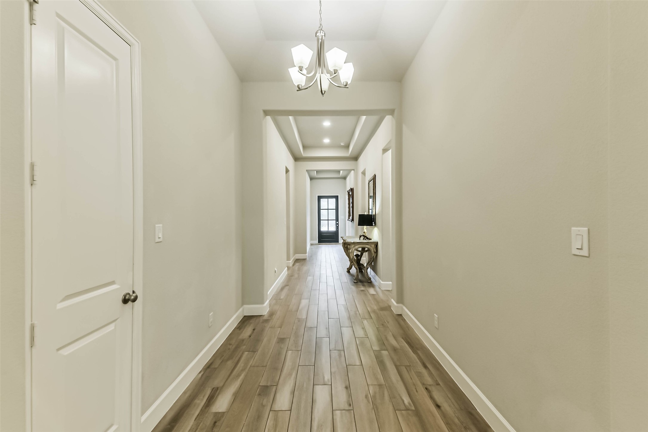 8132 Tyrell Hgts Road Magnolia, TX 77354 - Photo 7 of 40 Coffered extended entry leads to open-concept family room, kitchen, and dining area.