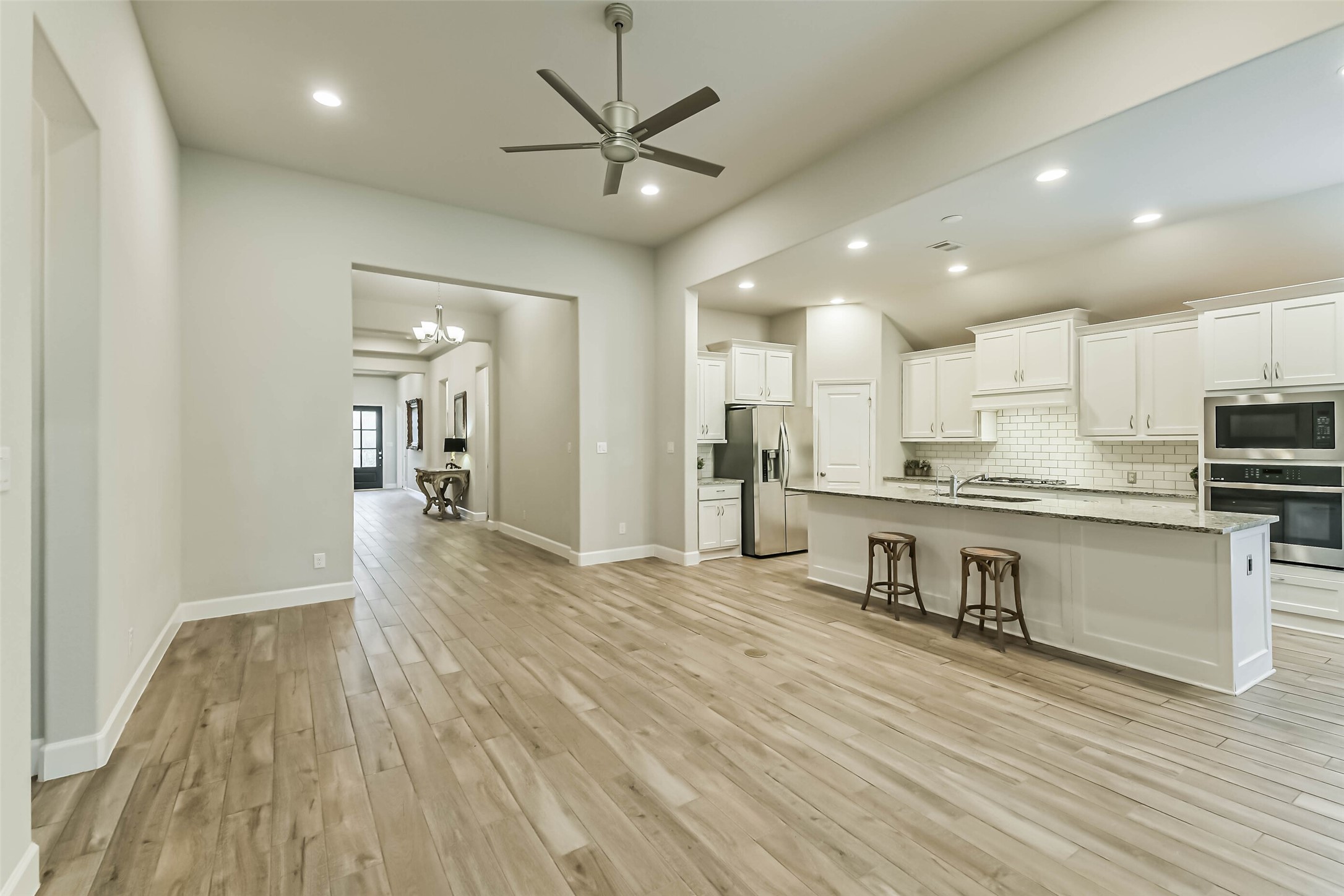 8132 Tyrell Hgts Road Magnolia, TX 77354 - Photo 39 of 40 This inviting home features an open floor plan ideal for entertaining and family gatherings, seamlessly blending modern elegance with comfort.